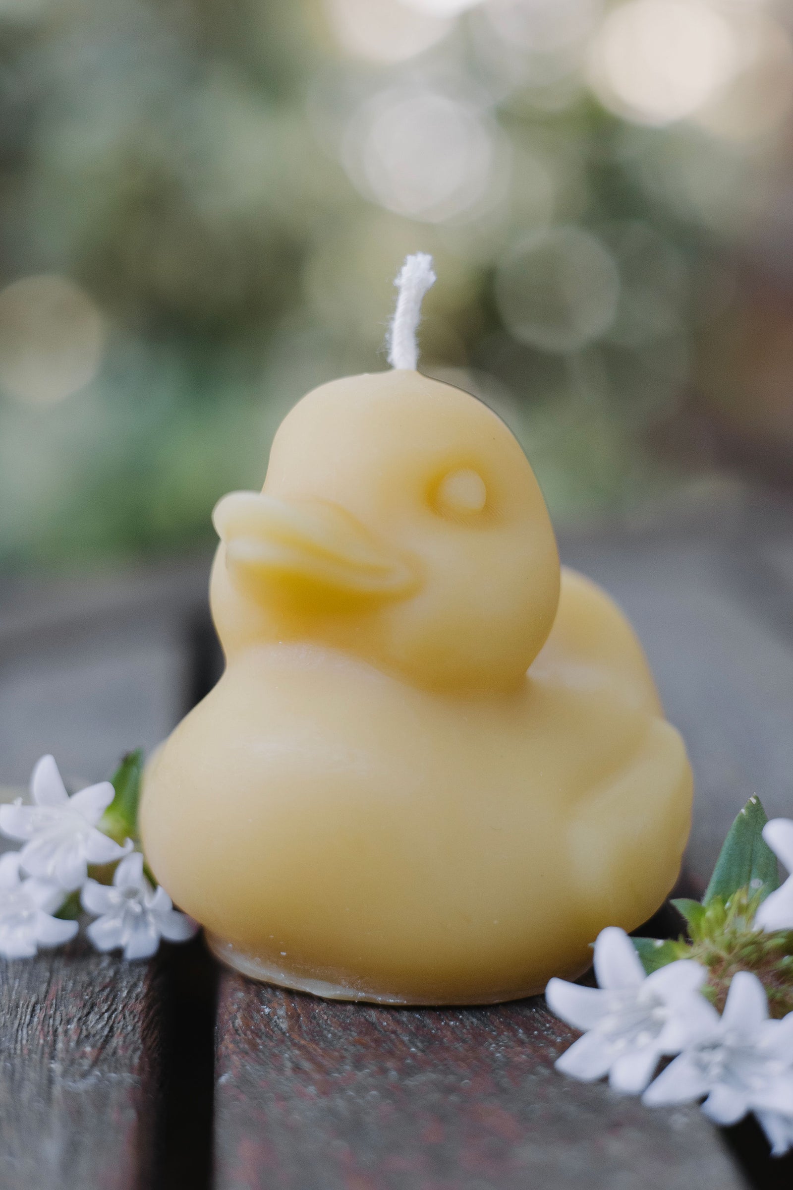 Adorable rubber duck-shaped beeswax candle, handmade in St. Petersburg, FL from natural beeswax by How’s Your Day Honey.