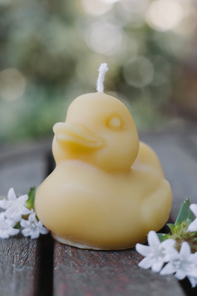 Adorable rubber duck-shaped beeswax candle, handmade in St. Petersburg, FL from natural beeswax by How’s Your Day Honey.