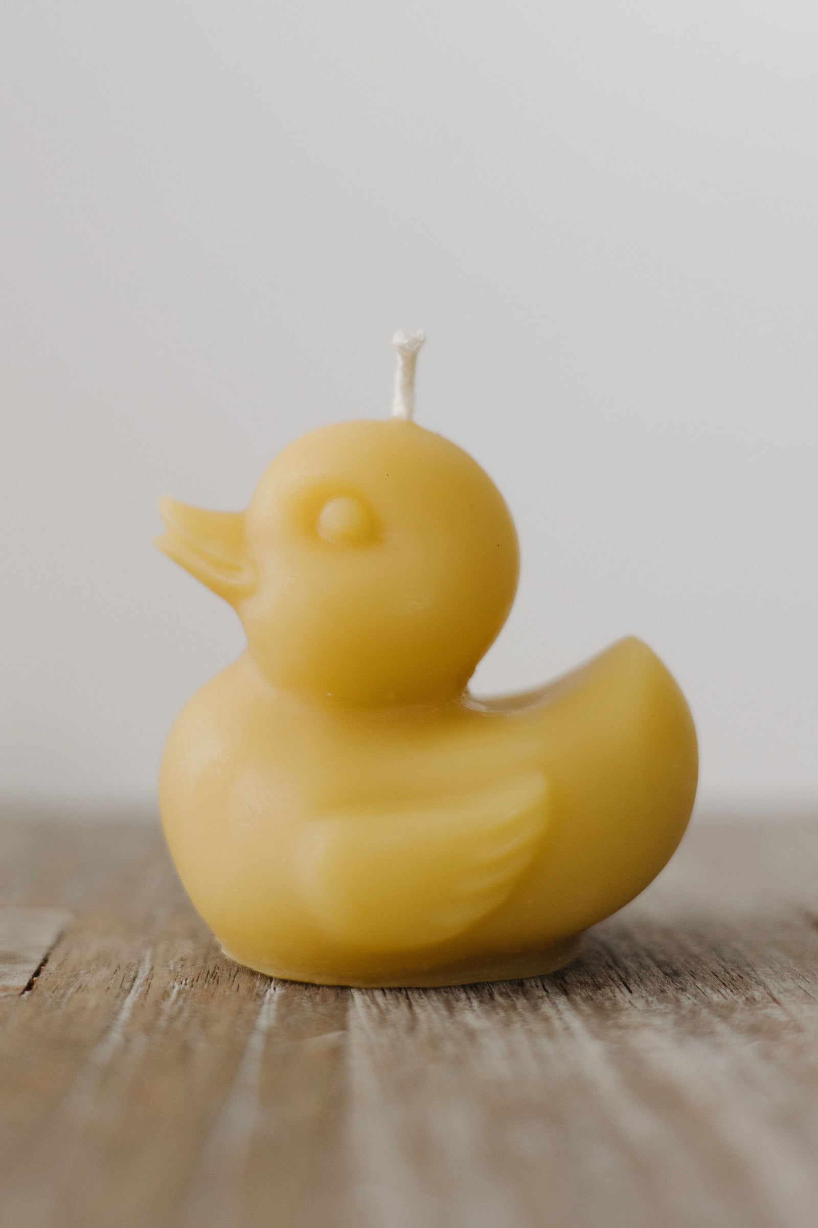 Adorable rubber duck-shaped beeswax candle, handmade in St. Petersburg, FL from natural beeswax by How’s Your Day Honey.
