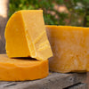 Pure raw beeswax melted and purified in large chunks sold by the pound from How's Your Day Honey
