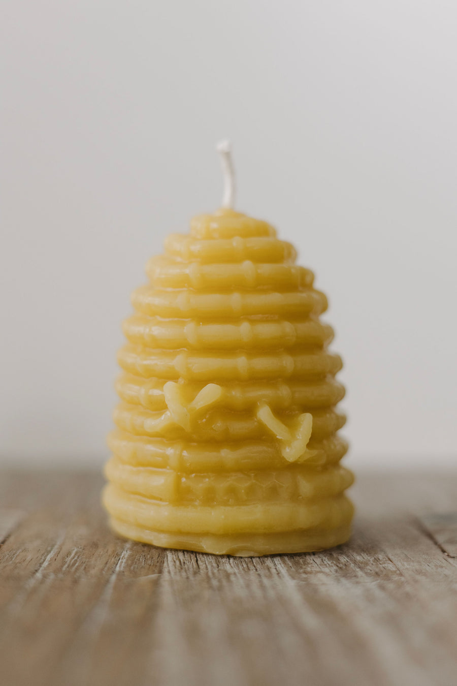 Hand-poured mini beeswax bee skep candle — natural, eco-friendly, clean-burning candle made from rescued bees in St. Petersburg, FL.