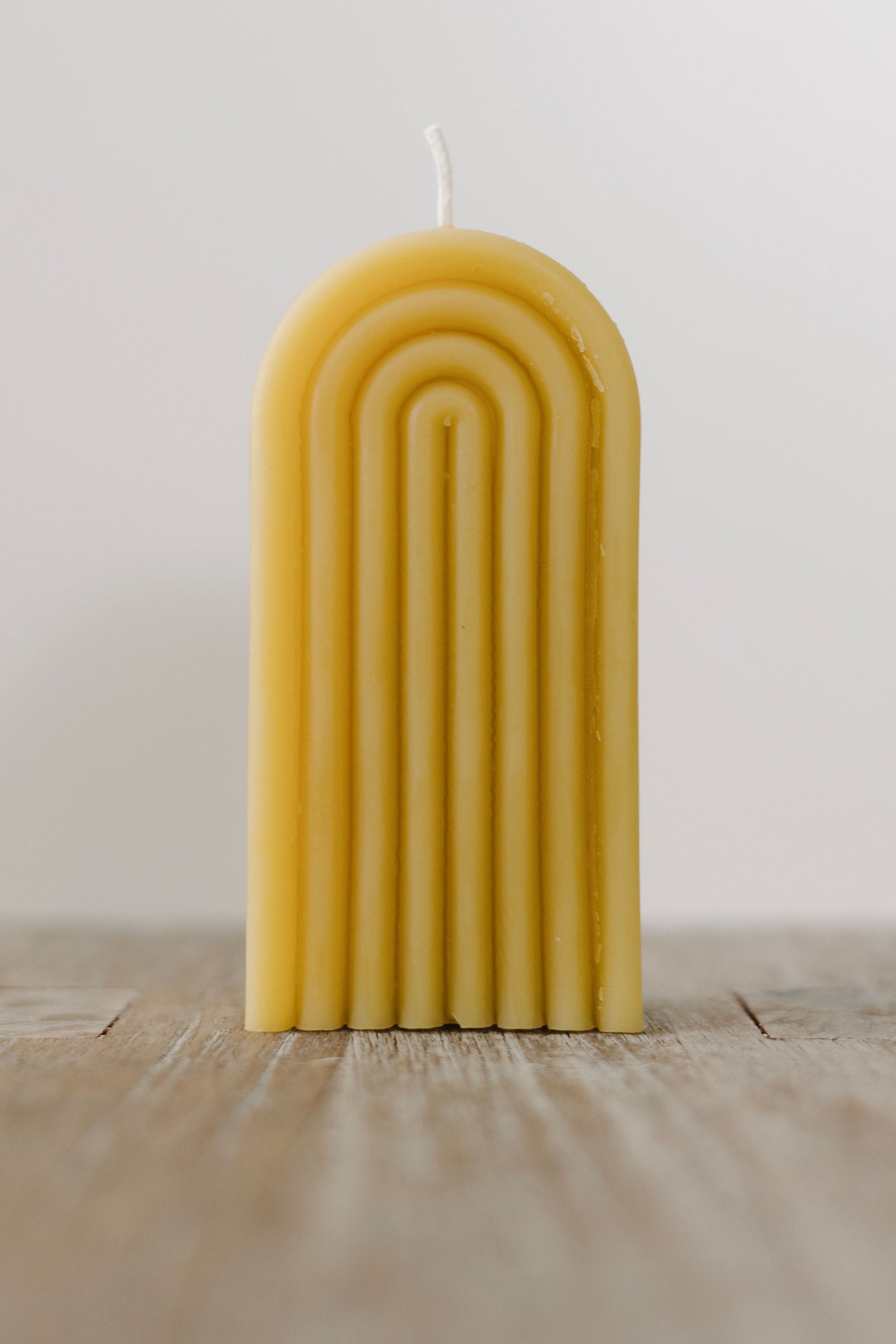 Handmade natural beeswax rainbow candle — eco-friendly, non-toxic, clean-burning décor made in St. Petersburg, FL from rescued bees.